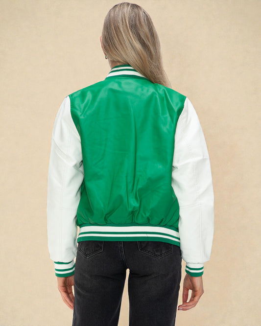 Person wearing a green and white varsity jacket on a beige background