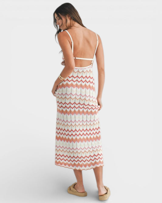 Woman wearing a striped dress with a white background