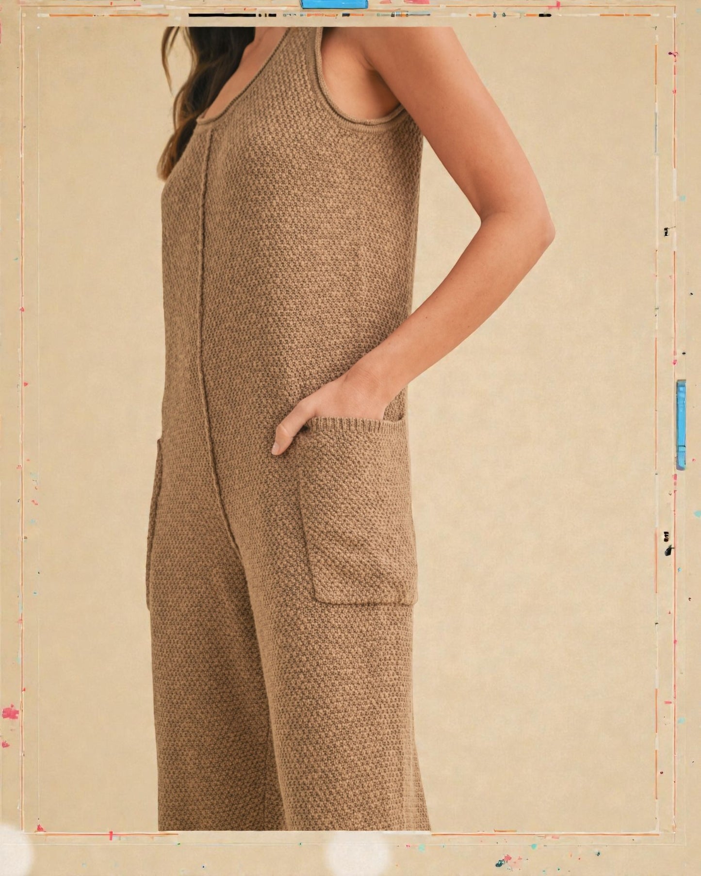 Brown knitted dress with pockets on a beige background
