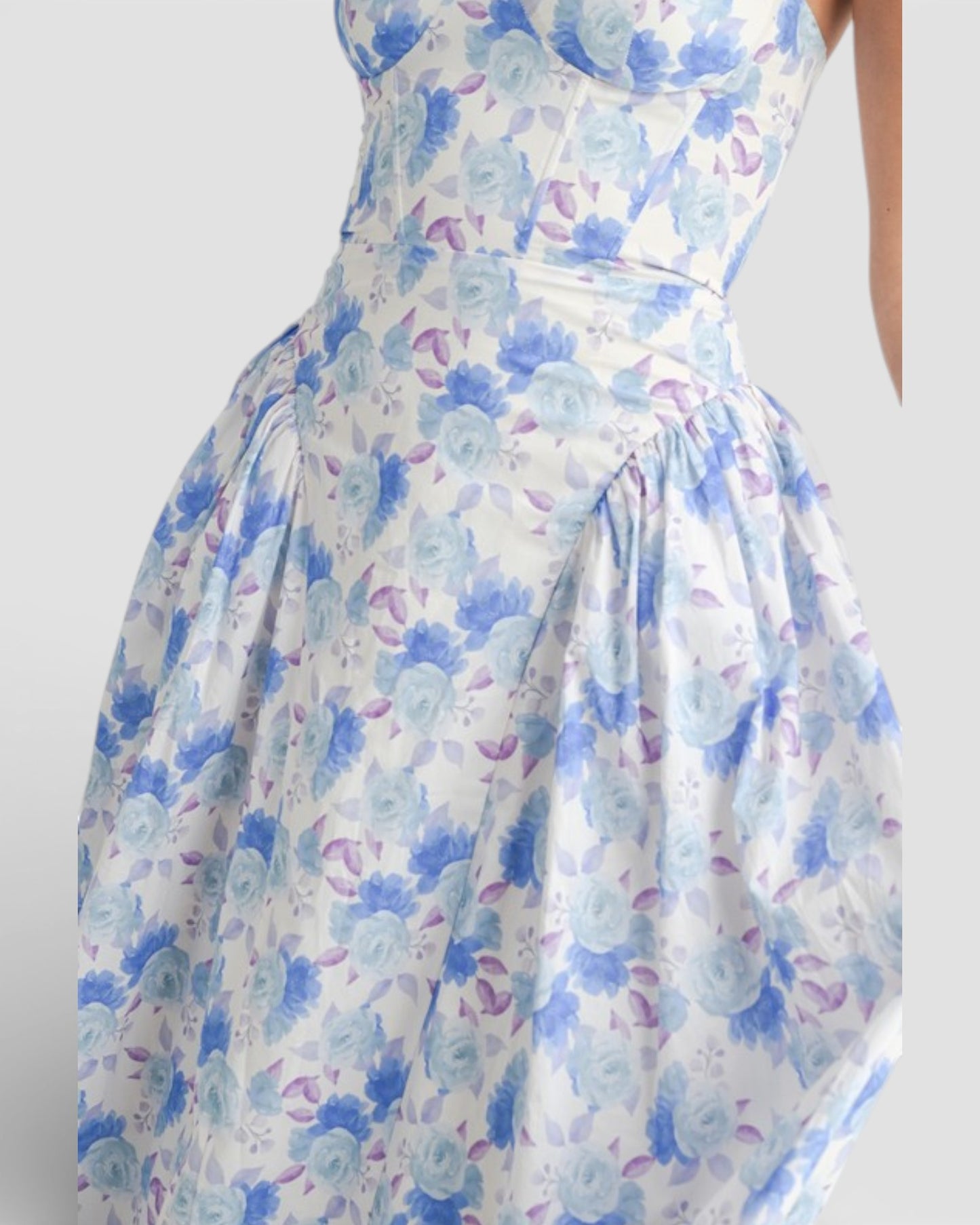 Floral dress with blue and pink flowers on a white background