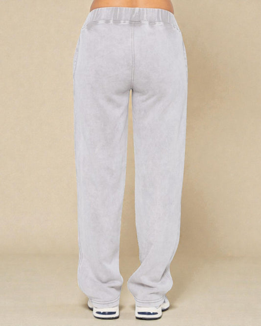 Light gray sweatpants on a beige background