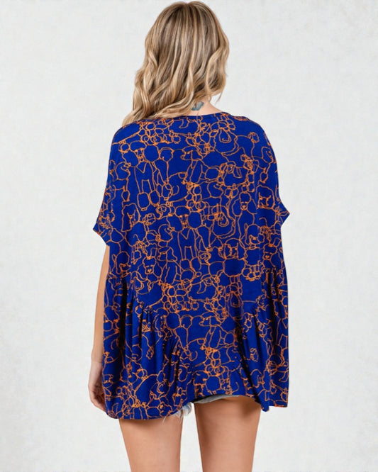 Woman wearing a blue patterned dress on a white background