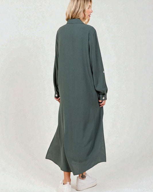 Woman wearing a long green dress on a white background