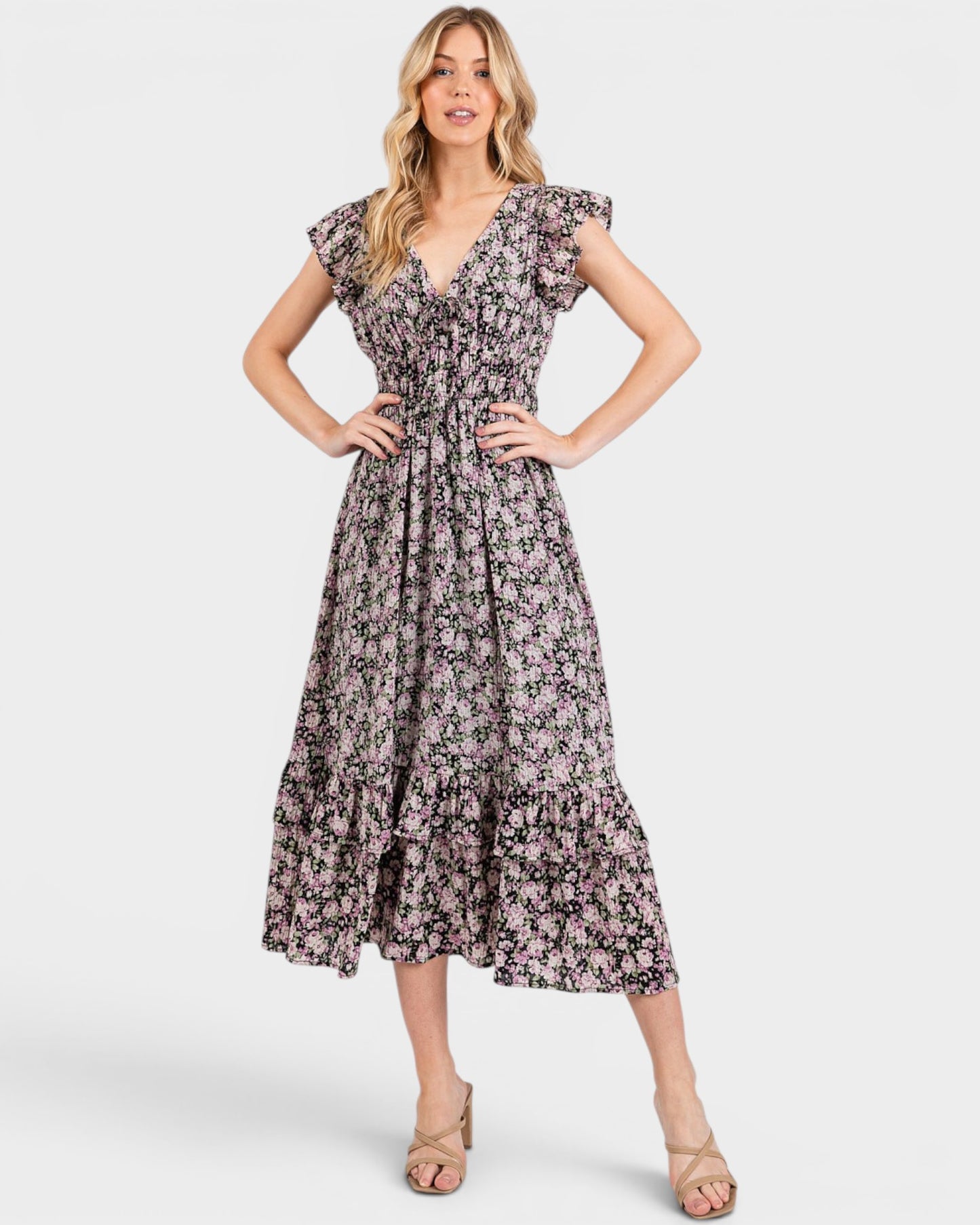 Woman wearing a floral dress on a white background