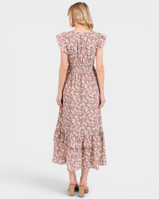 Woman wearing a floral dress on a white background