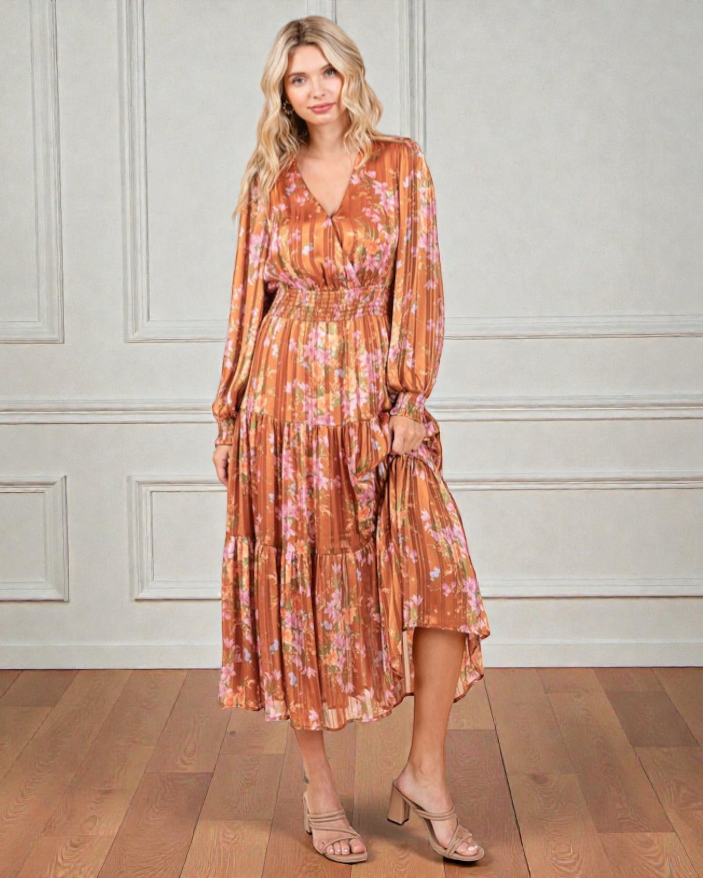 Woman wearing a floral dress with a neutral background