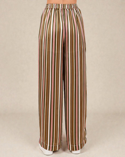 Striped pants with a pattern of brown, green, and pink on a beige background
