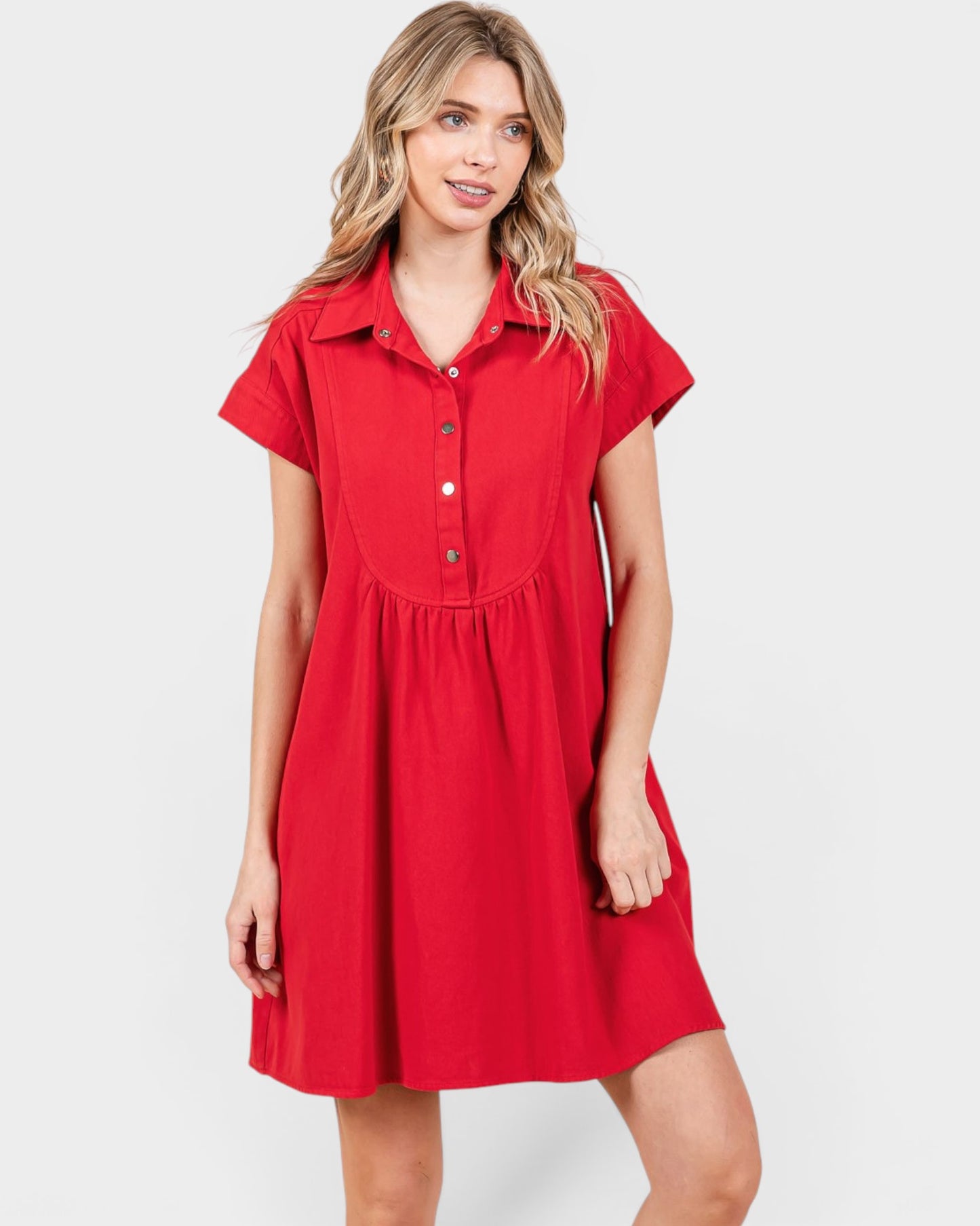 Woman wearing a red dress on a white background