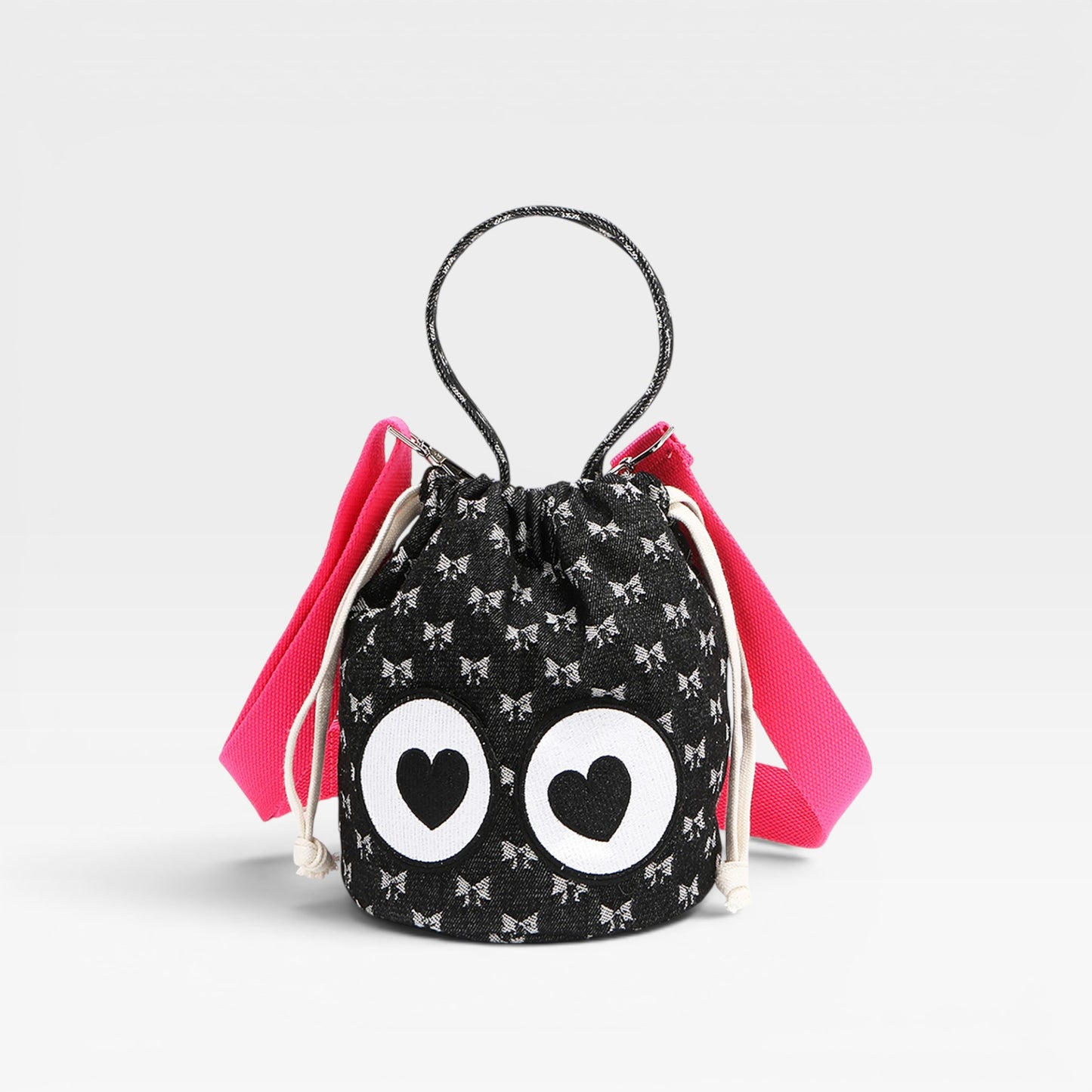 Drawstring bag with heart-shaped eyes and pink accents on a light gray background