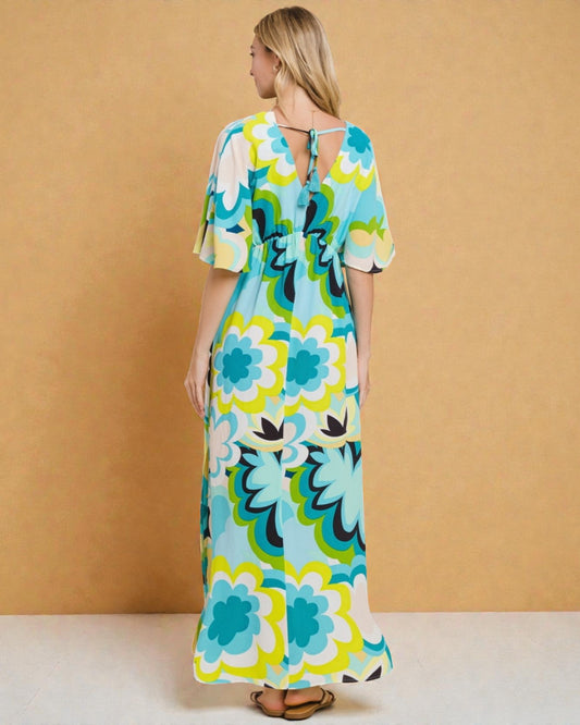 Woman wearing a floral dress against a beige background