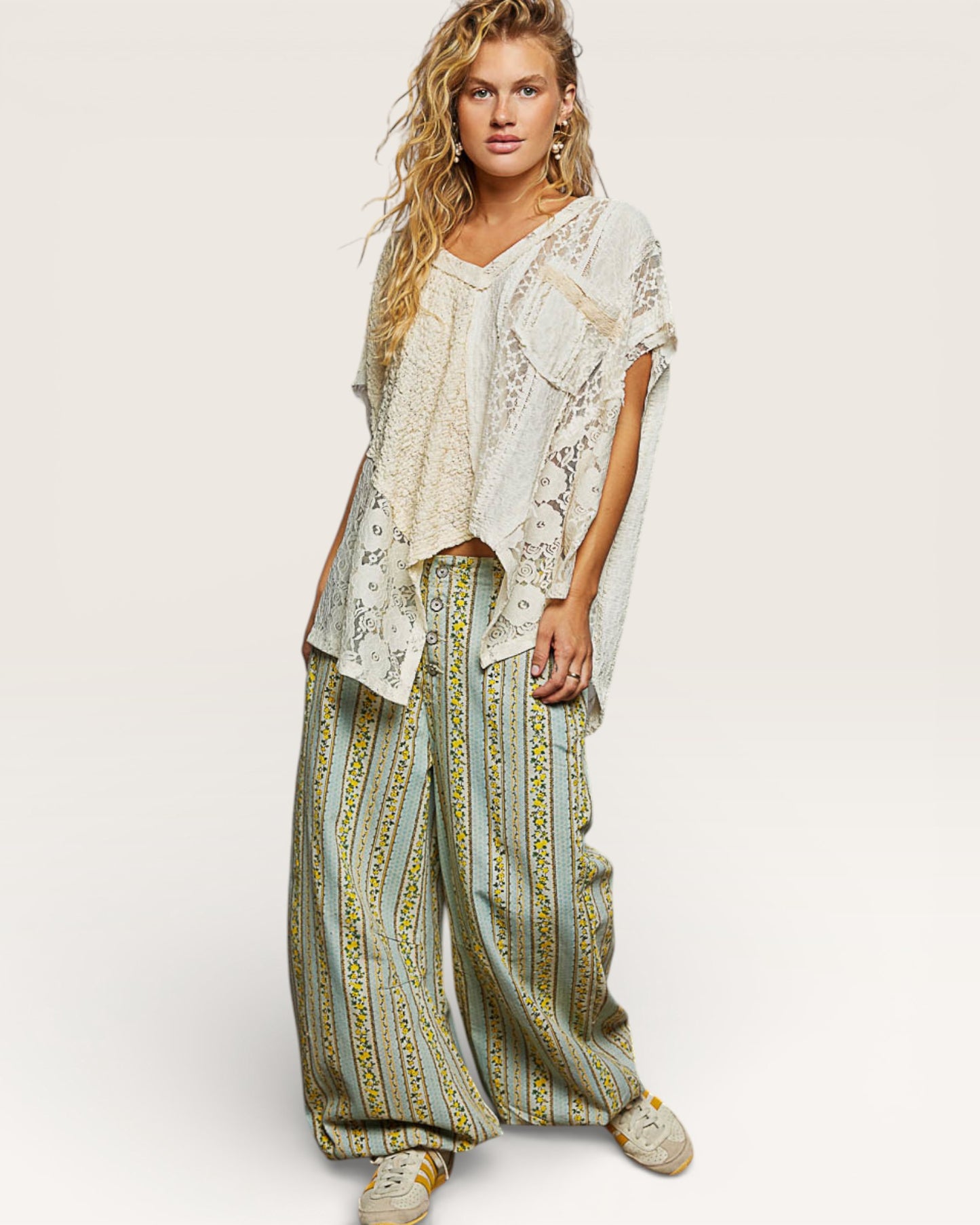 Woman wearing a patterned outfit with a white background