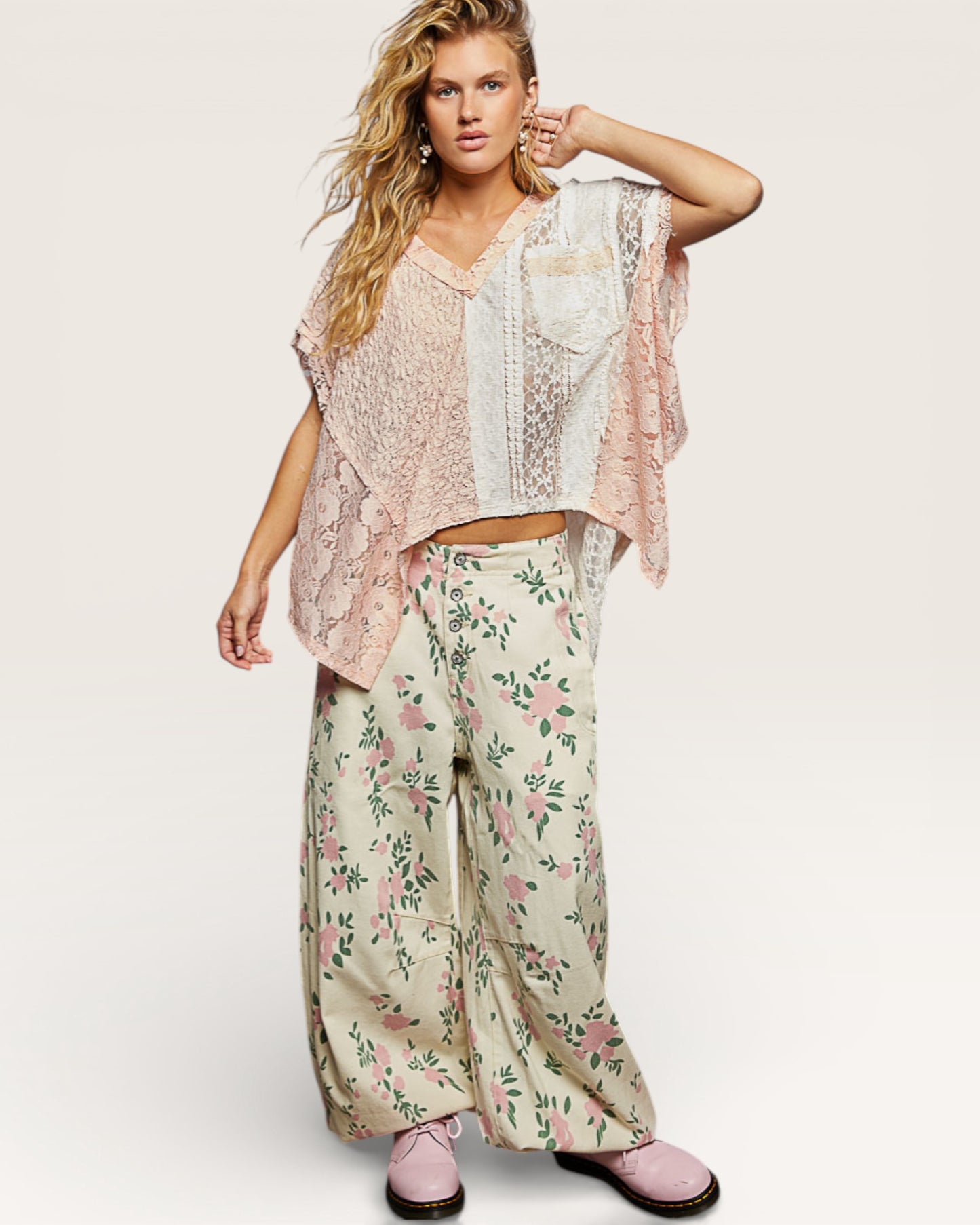 Woman wearing a floral outfit with a light background