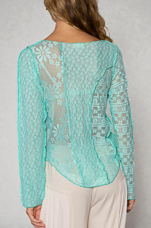 Mint green lace top worn by a person on a plain background