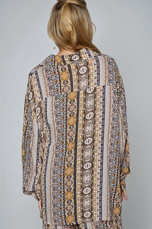 Patterned shirt worn by a person on a gray background