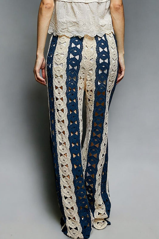 Person wearing a patterned pants with a plain background