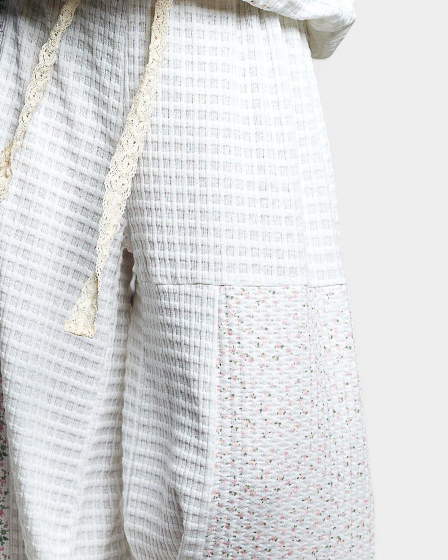 Textured fabric with a checkered pattern on a white background
