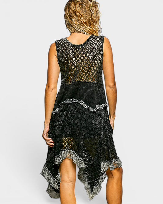 Black lace dress worn by a person on a white background