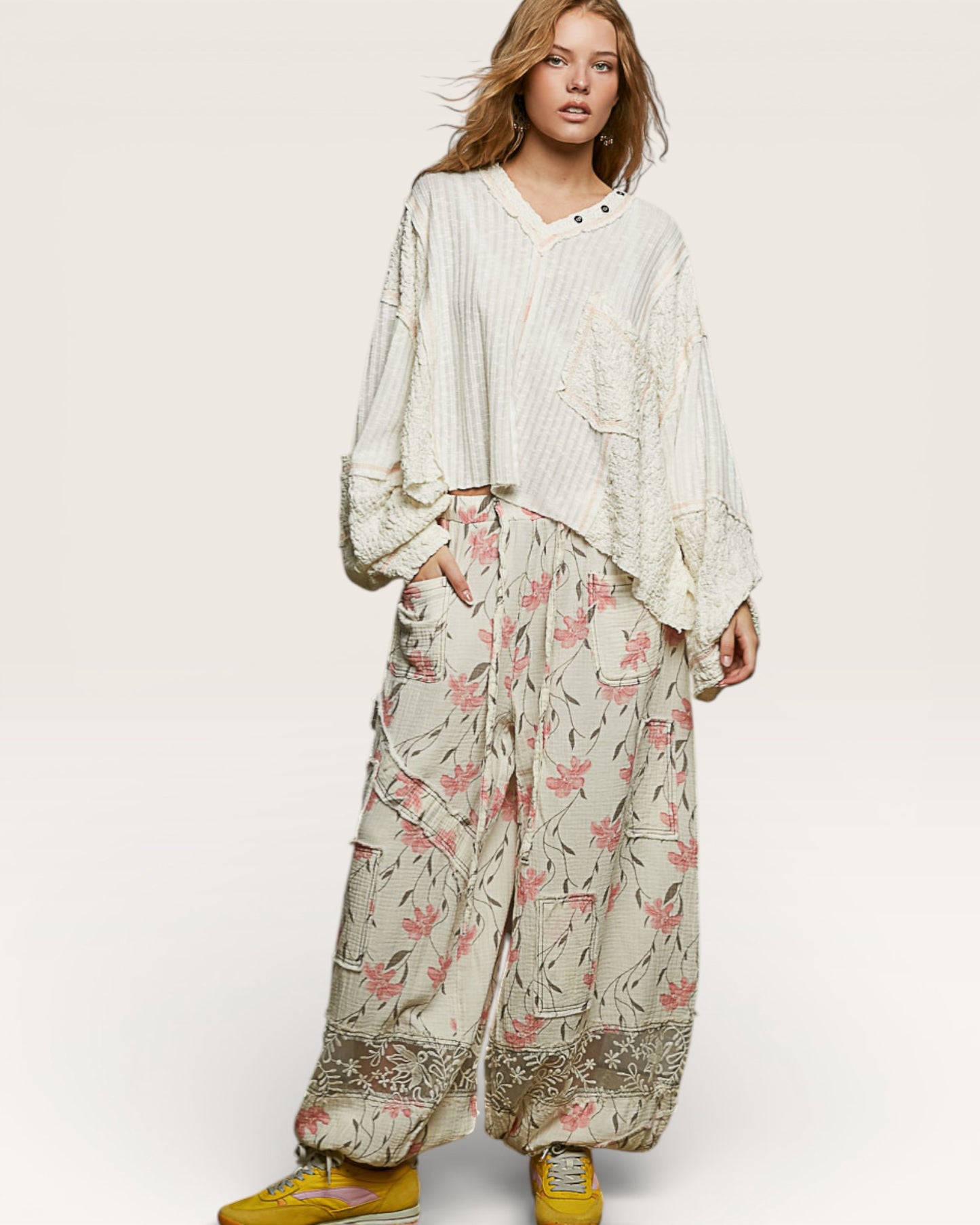 Woman wearing a floral outfit with a white background