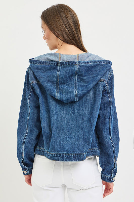 Blue denim jacket with a hood worn by a person on a white background