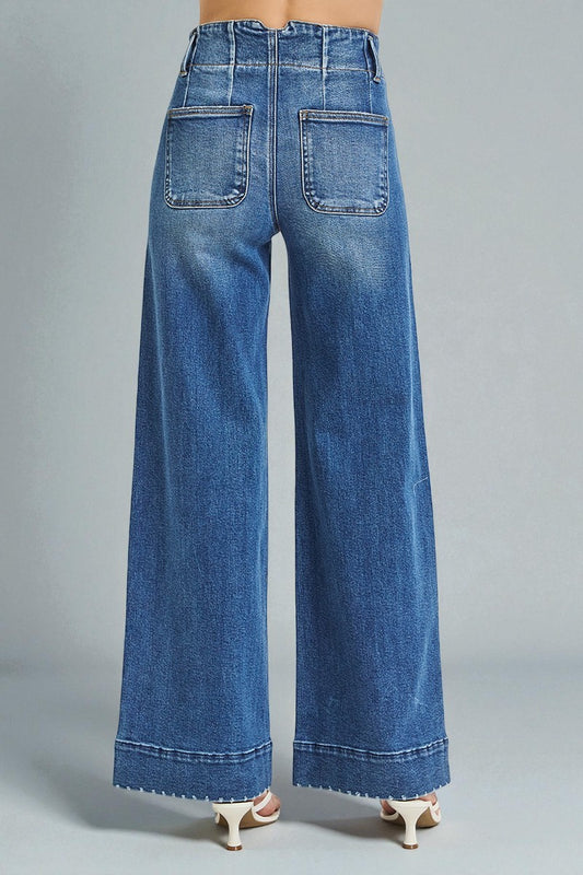 Blue wide-leg jeans on a gray background