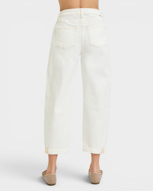 White denim skirt worn by a person on a white background