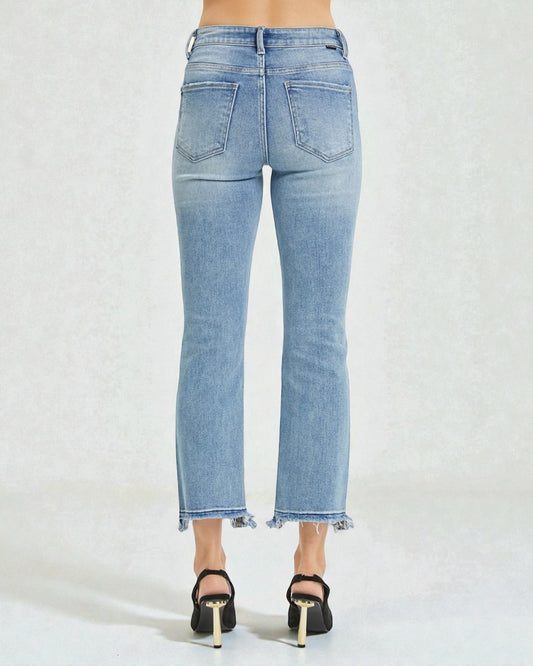 Light blue jeans worn by a person on a white background