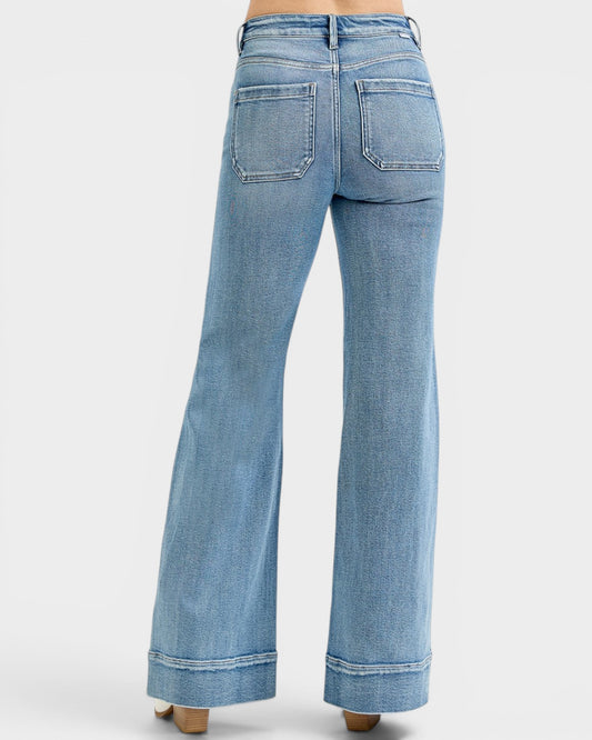 Light blue flared jeans on a white background