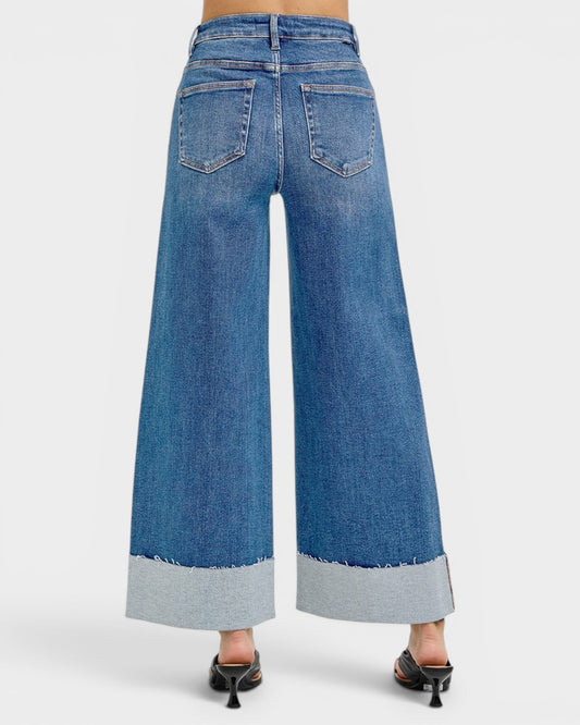 Blue wide-leg jeans on a white background