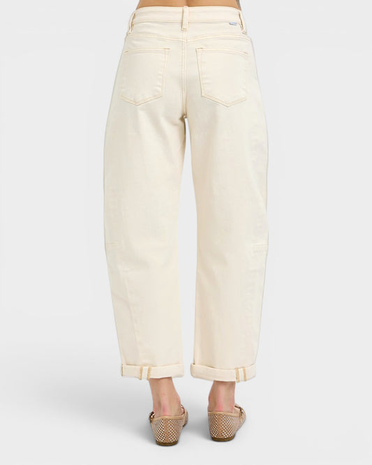 White pants worn by a person on a white background