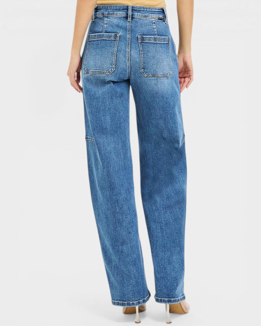 Blue jeans worn by a person on a white background