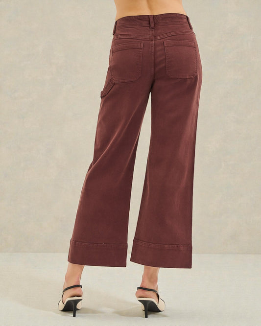 Brown wide-leg pants worn by a person on a neutral background