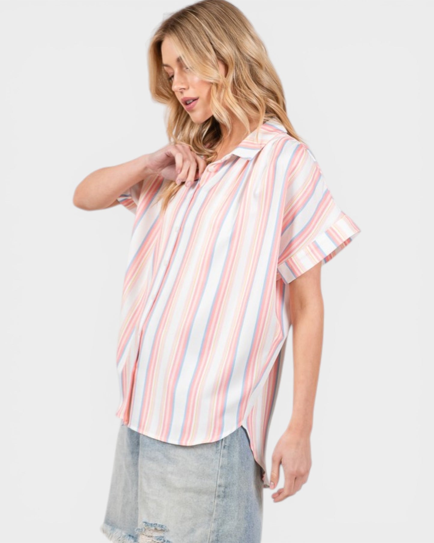Woman wearing a striped shirt with a plain background