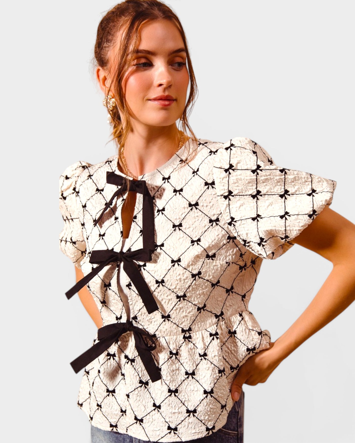 Ivory & Black Bow Peplum Top