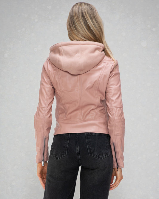 Person wearing a pink leather jacket on a gray background