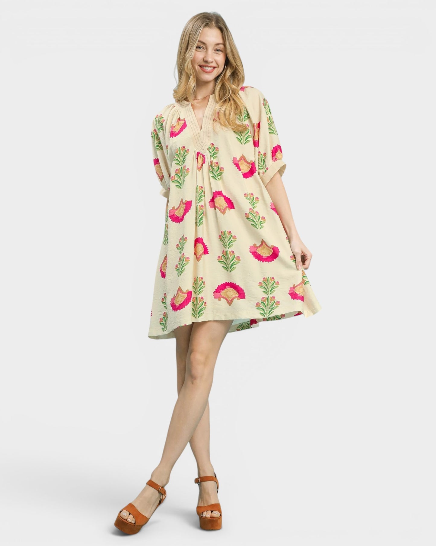 Woman wearing a floral dress on a white background