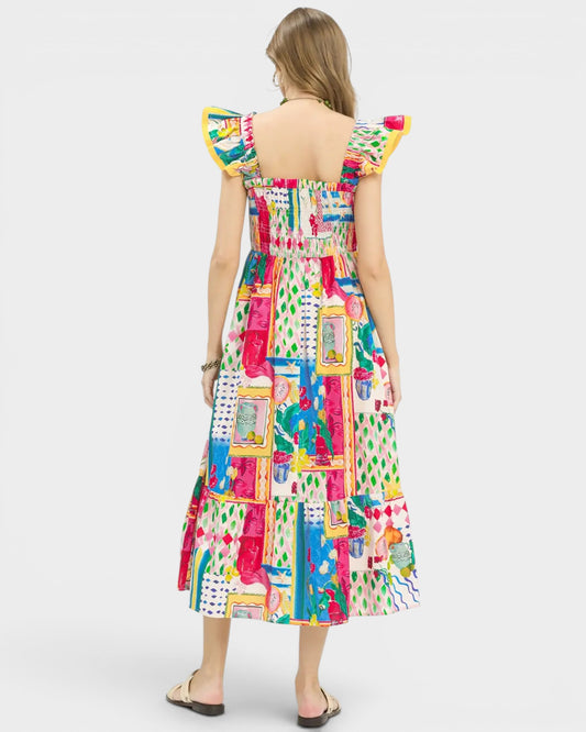 Woman wearing a colorful patterned dress on a white background