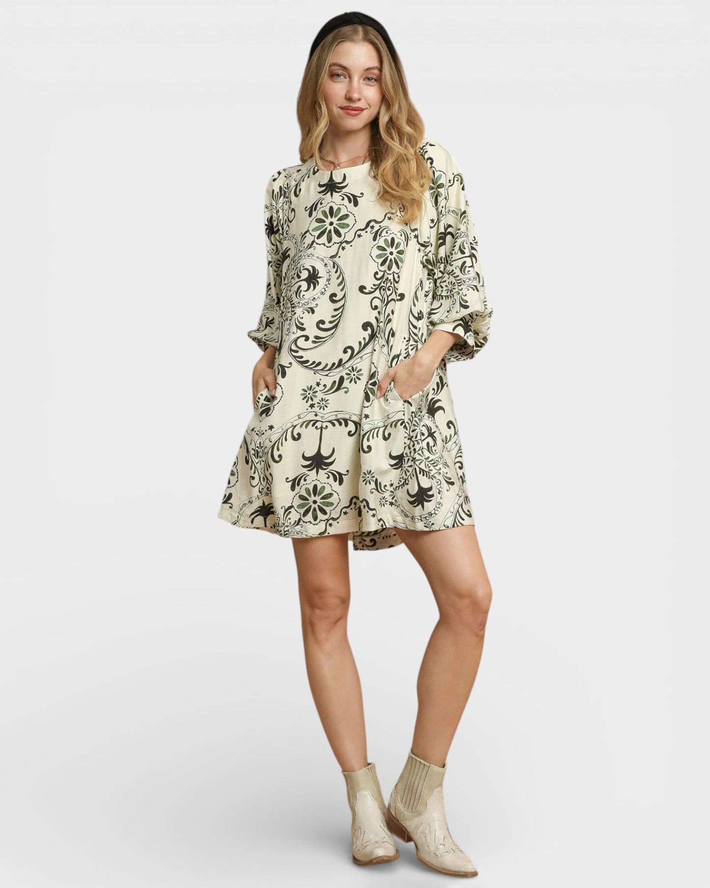 Woman wearing a floral dress on a white background