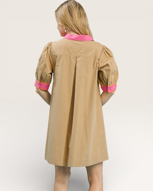 Beige dress with pink accents on a white background