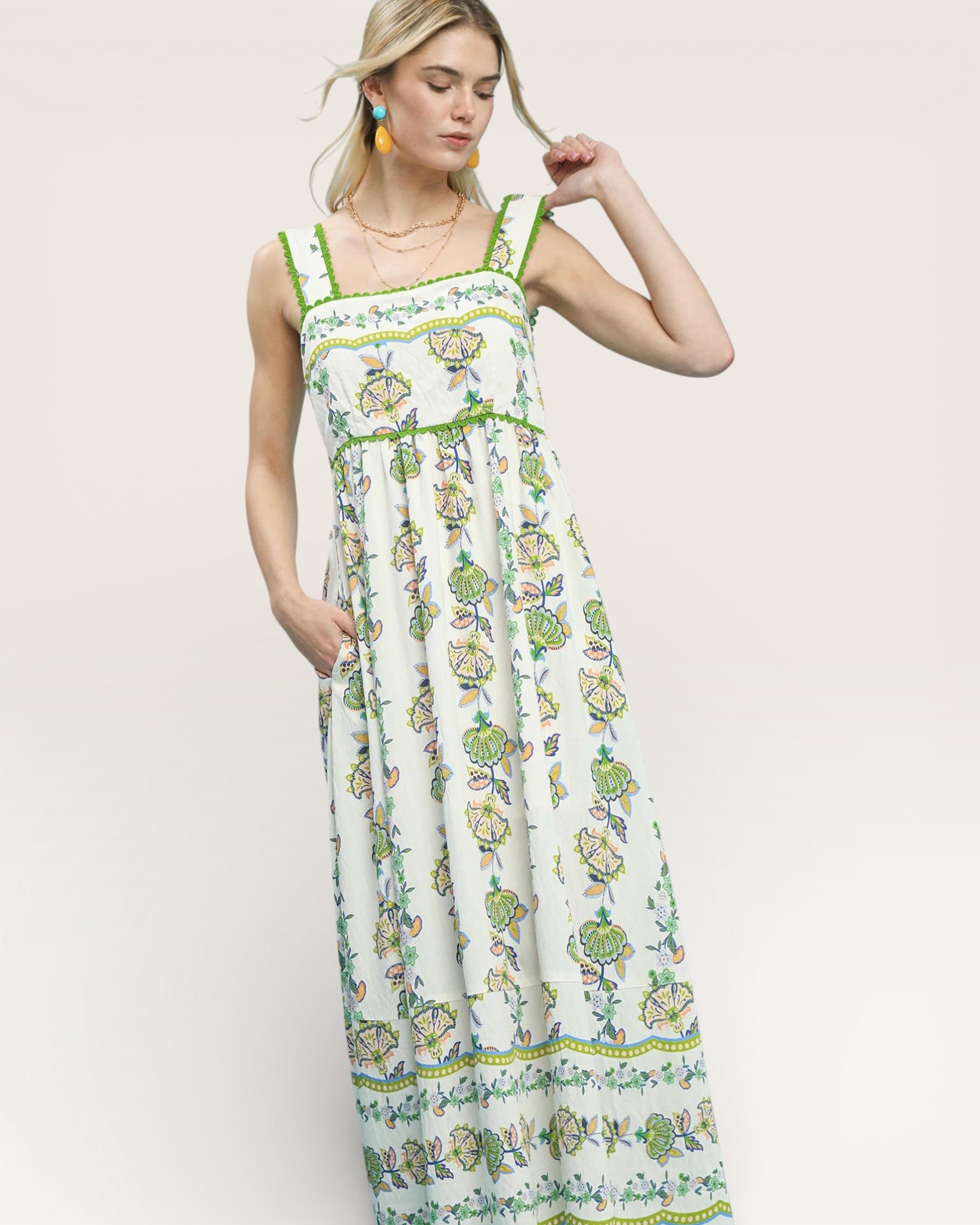 Woman wearing a floral dress on a white background