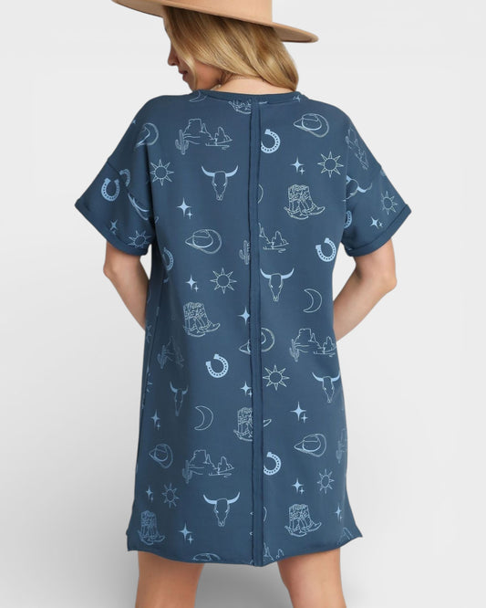 Woman wearing a blue dress with western pattern on a white background