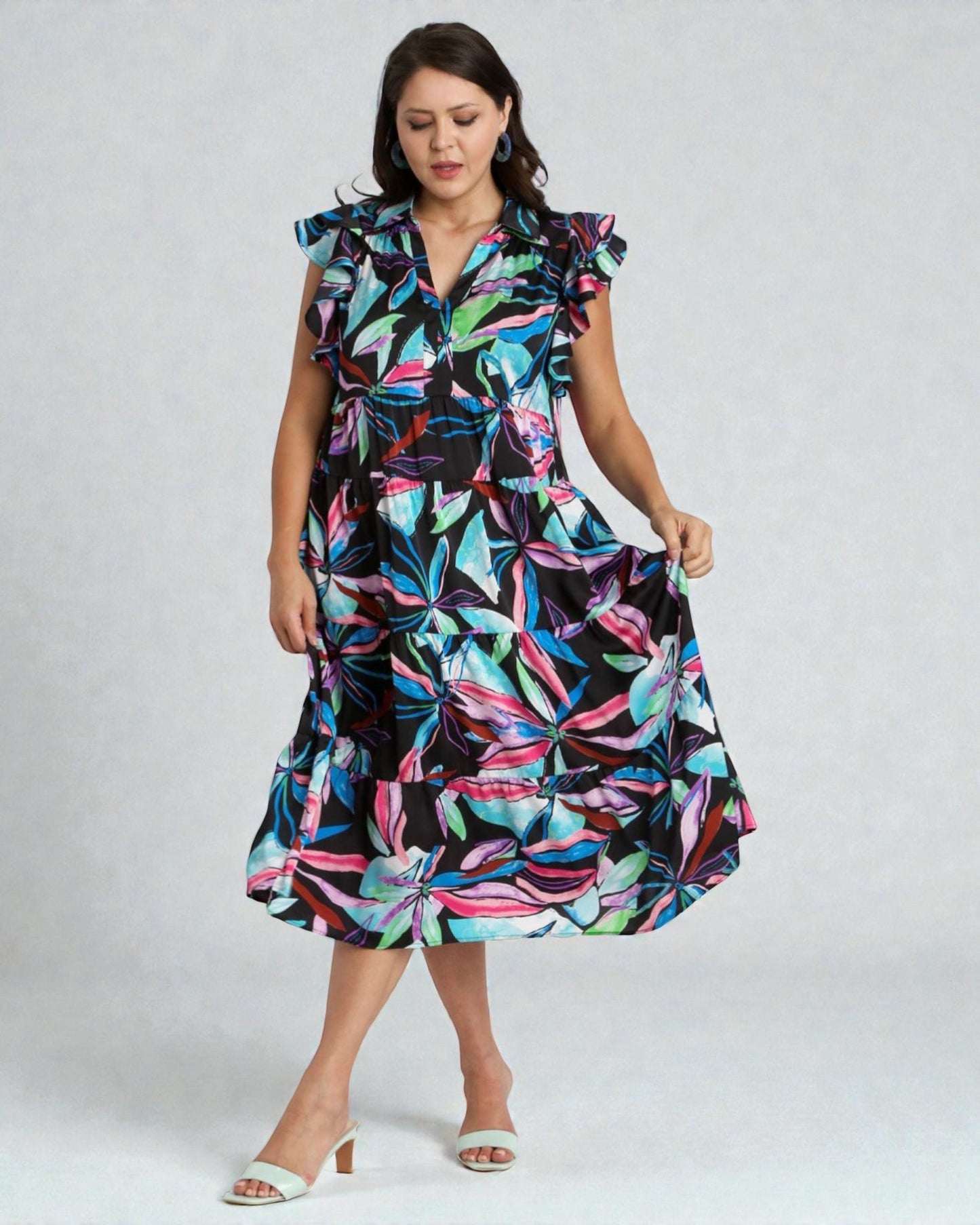 Woman wearing a colorful dress with a white background