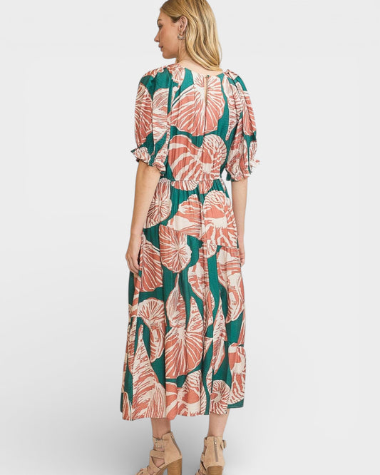 Woman wearing a floral dress on a white background