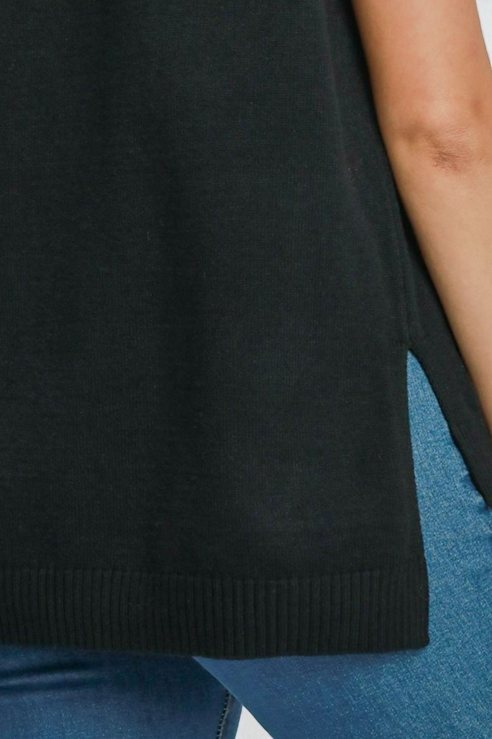 Black sleeveless top worn by a person with a blurred background