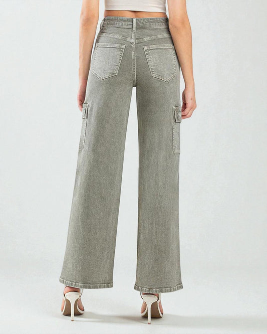 Person wearing light gray wide-leg jeans on a white background