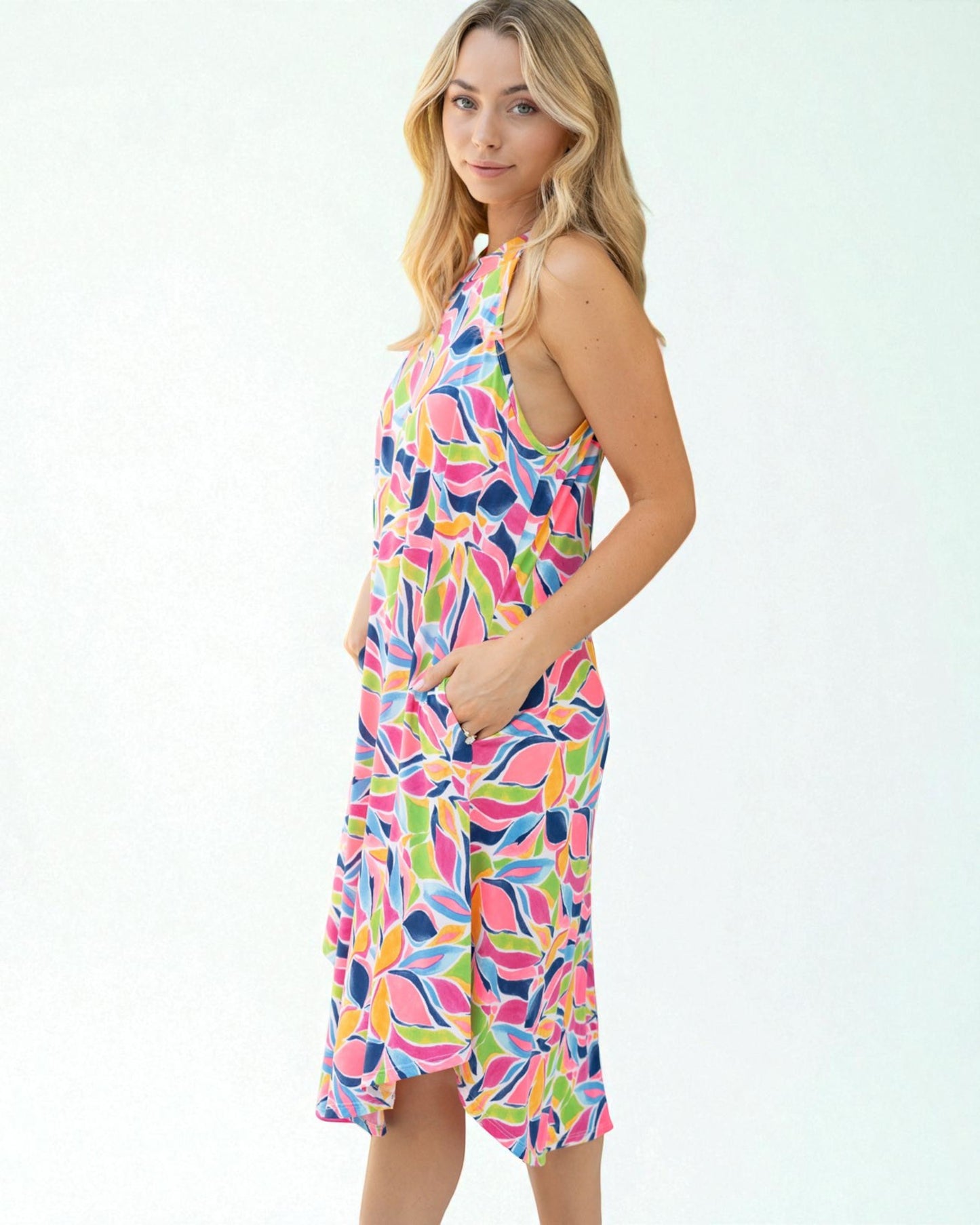 Woman wearing a colorful dress with a white background