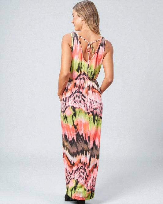 Woman wearing a colorful sleeveless dress on a white background