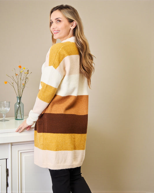 Woman wearing a striped sweater in a kitchen setting