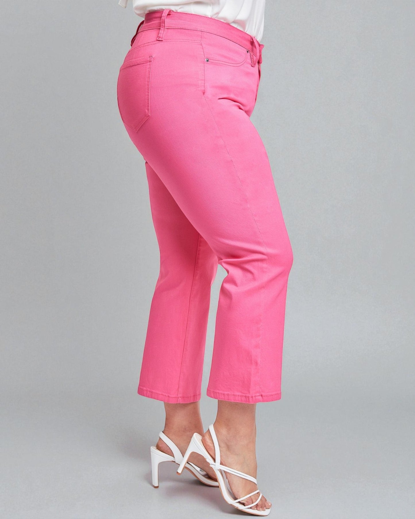 Pink pants worn by a person on a gray background