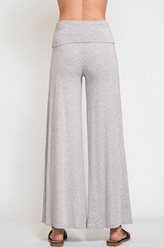 Gray wide-leg pants worn by a person on a white background