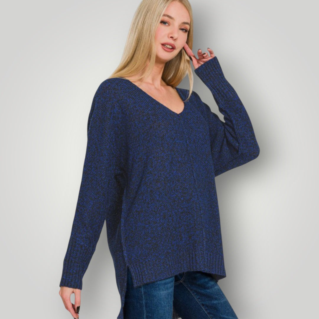 Woman wearing a blue sweater against a plain background